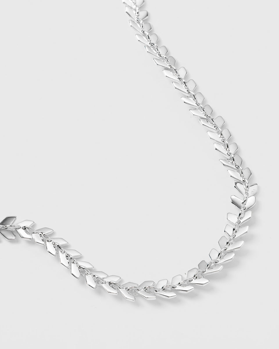 A close-up image of the silver Layers Olivia Bracelet, detailing its unique pattern of small, interconnected leaf-like links.