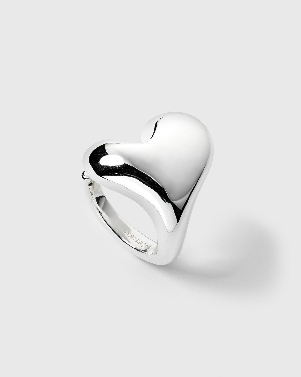 A product shot of the Bolded Heart Ring in silver, highlighting its chunky and smoothly polished heart-shaped design.