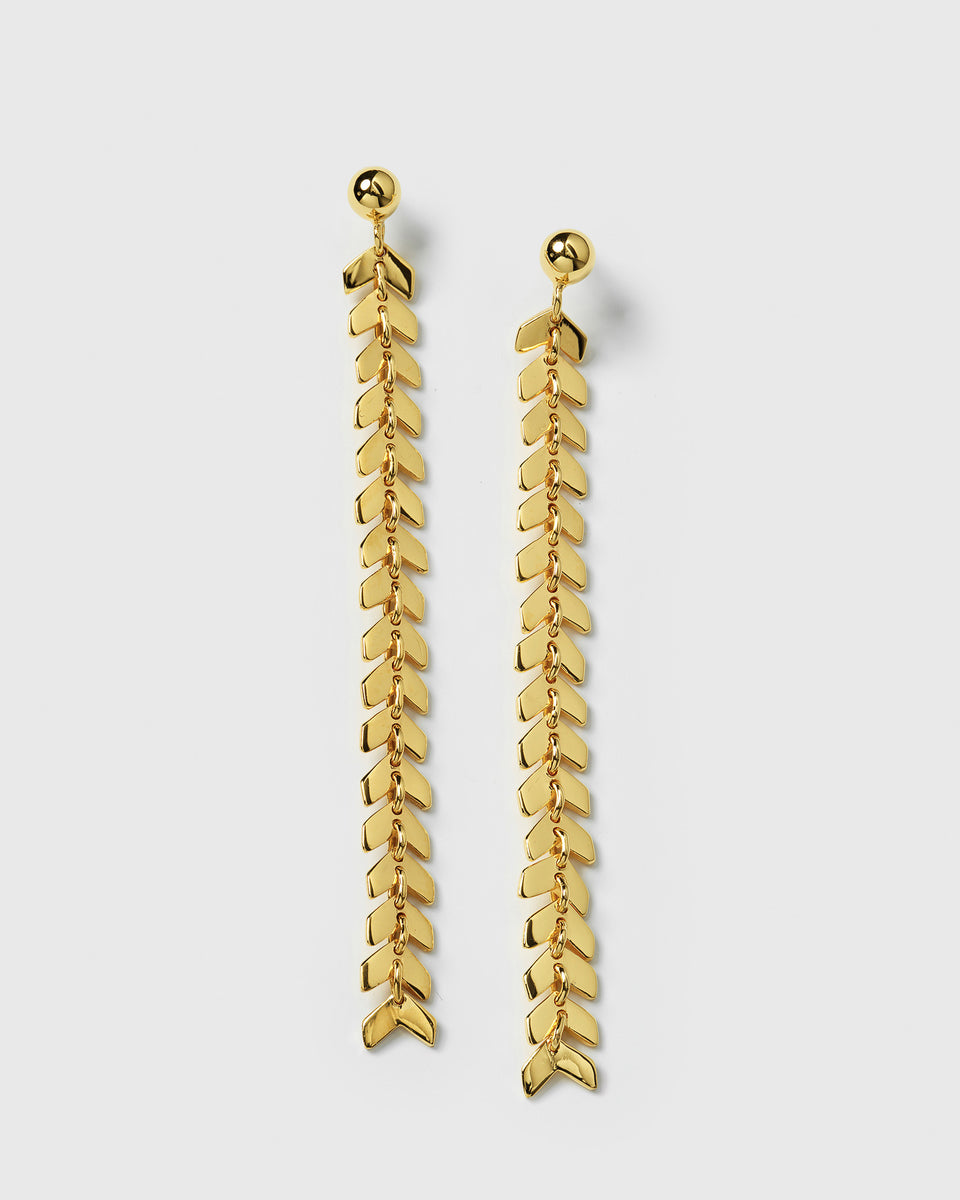 A product shot of the Layers Olivia Earrings in gold, displayed side by side to feature their long, dangling design composed of a chain of small, leaf-like charms.