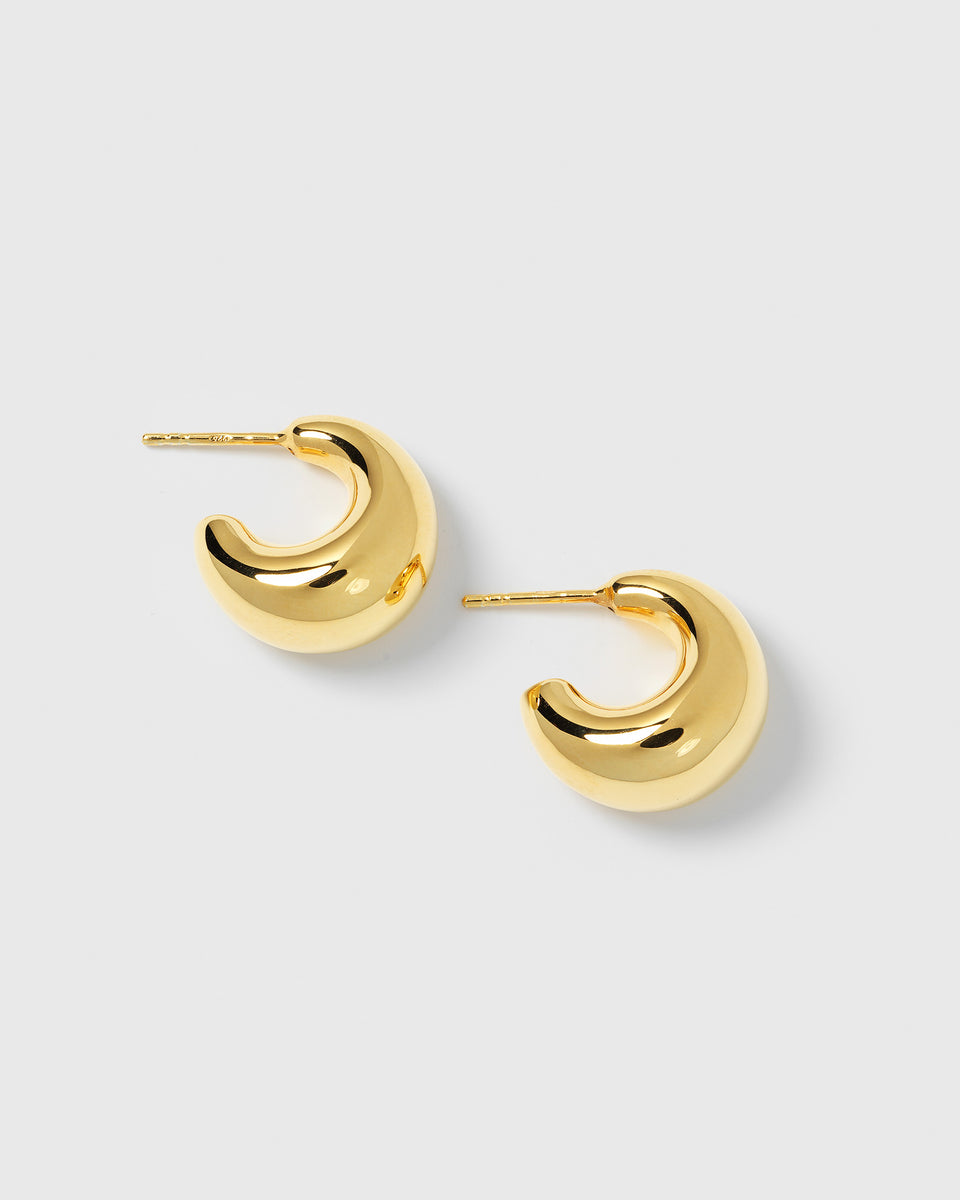 A product shot of the Bolded Little Sis Earrings in gold, showcasing their chunky, crescent-shaped design.