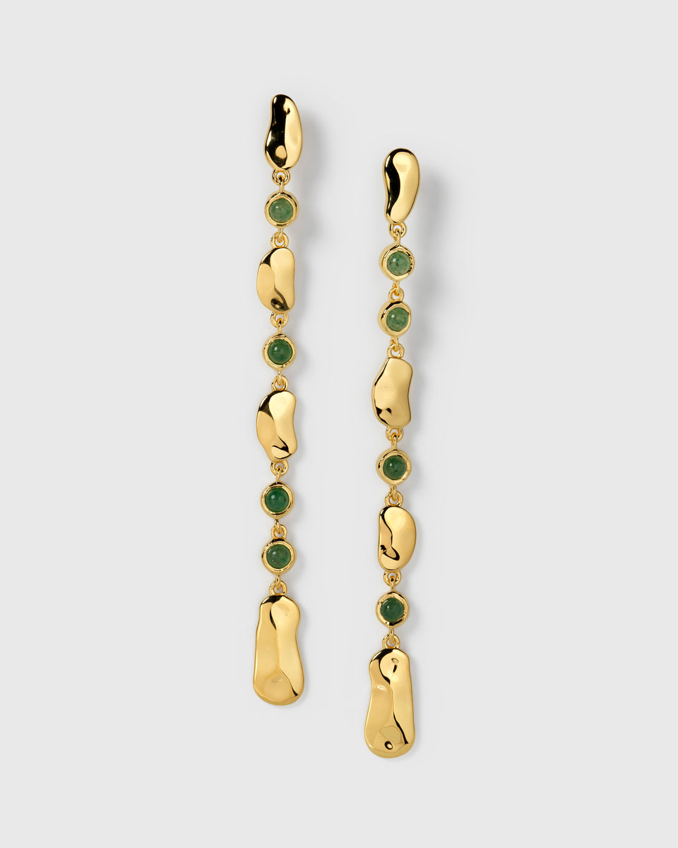 A product shot of the Florentina Long Earrings in gold, displaying their long design which features hammered gold plates alternating with round green jade stones.