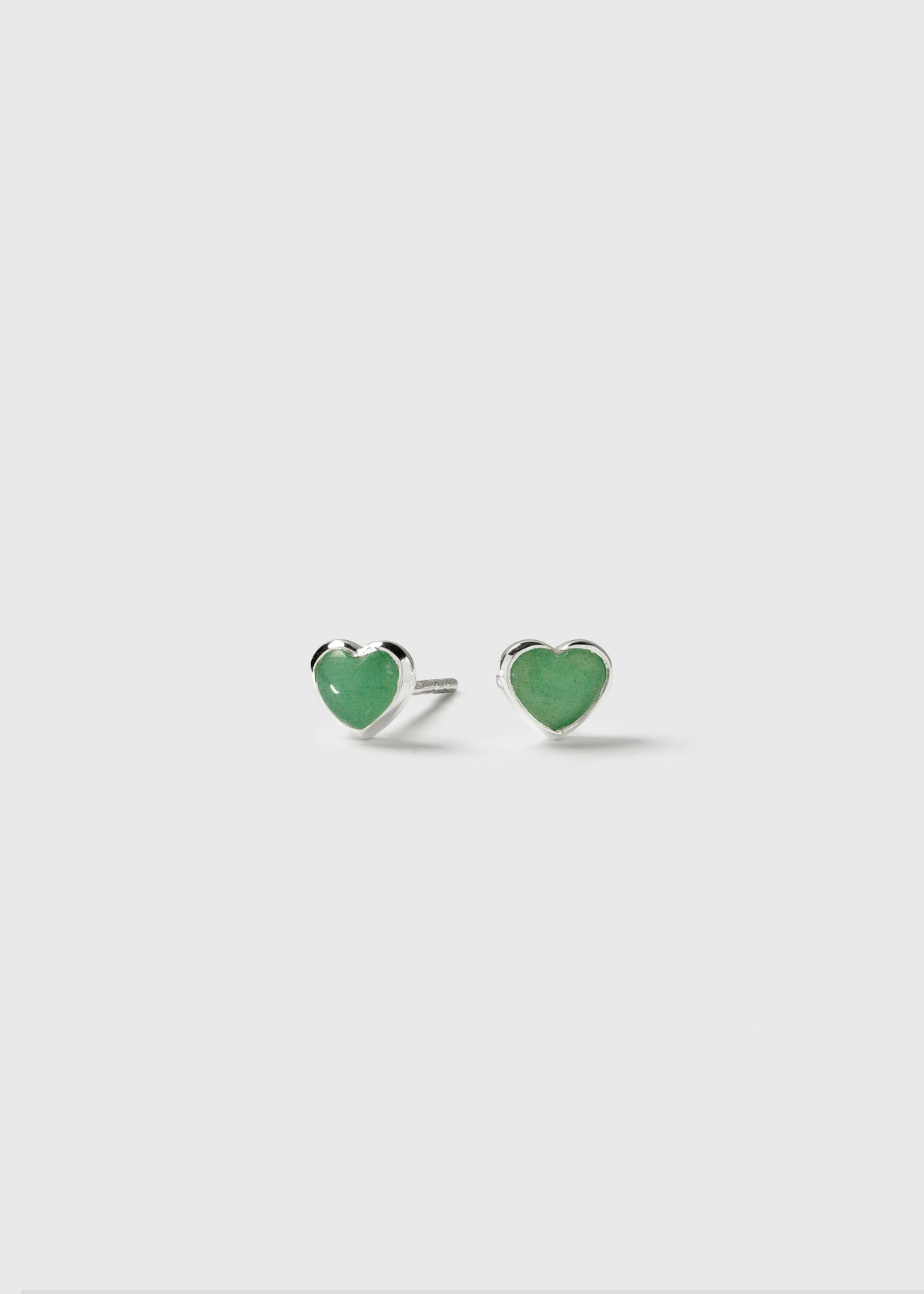 A pair of La La Love stud earrings in silver, featuring heart-shaped green jade stones.