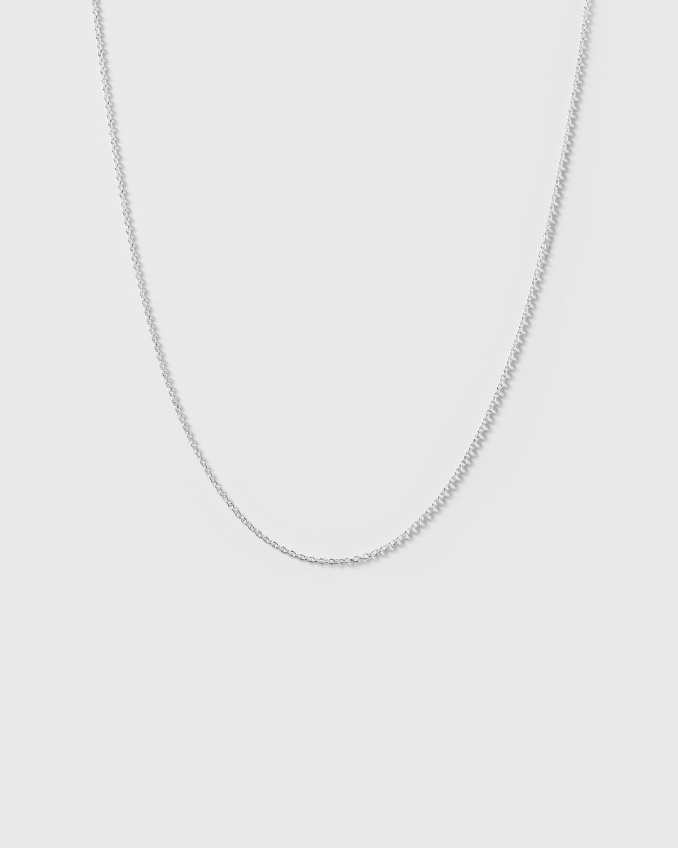 A product shot of the Beloved Short Oval Chain in silver, showcasing its fine anchor chain design.