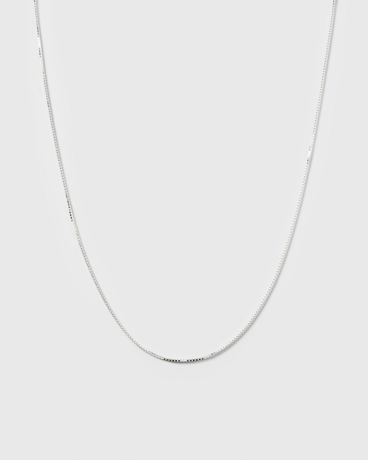 A product shot of the Beloved Medium Box Chain in silver, showing the delicate and timeless design of the necklace.