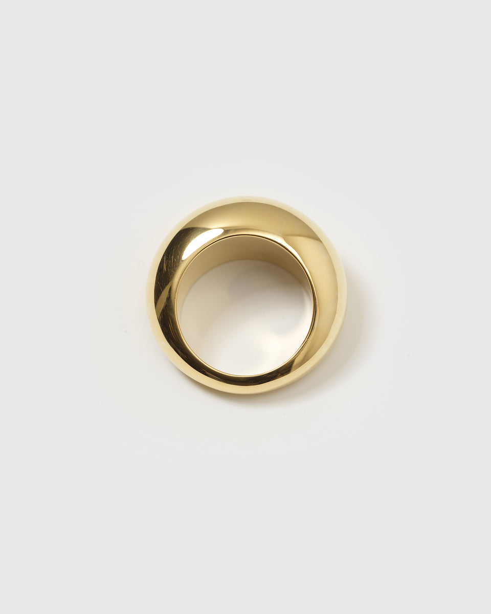 A product shot of the Bolded Big Ring in gold, displaying its chunky, wide band with a smooth, domed finish.