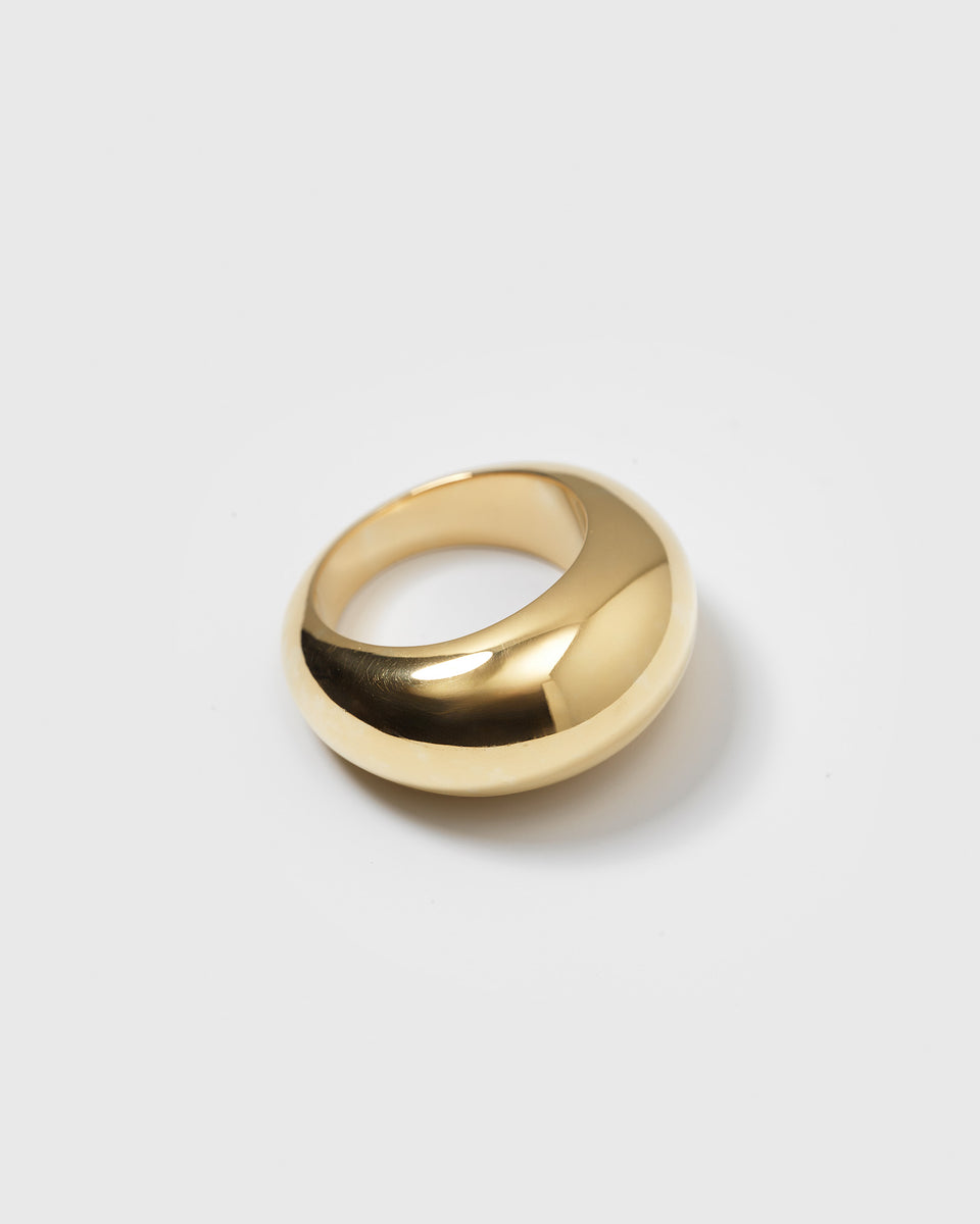 A product shot of the Bolded Big Ring in gold, featuring its thick, dome-shaped band with a high-polish finish.
