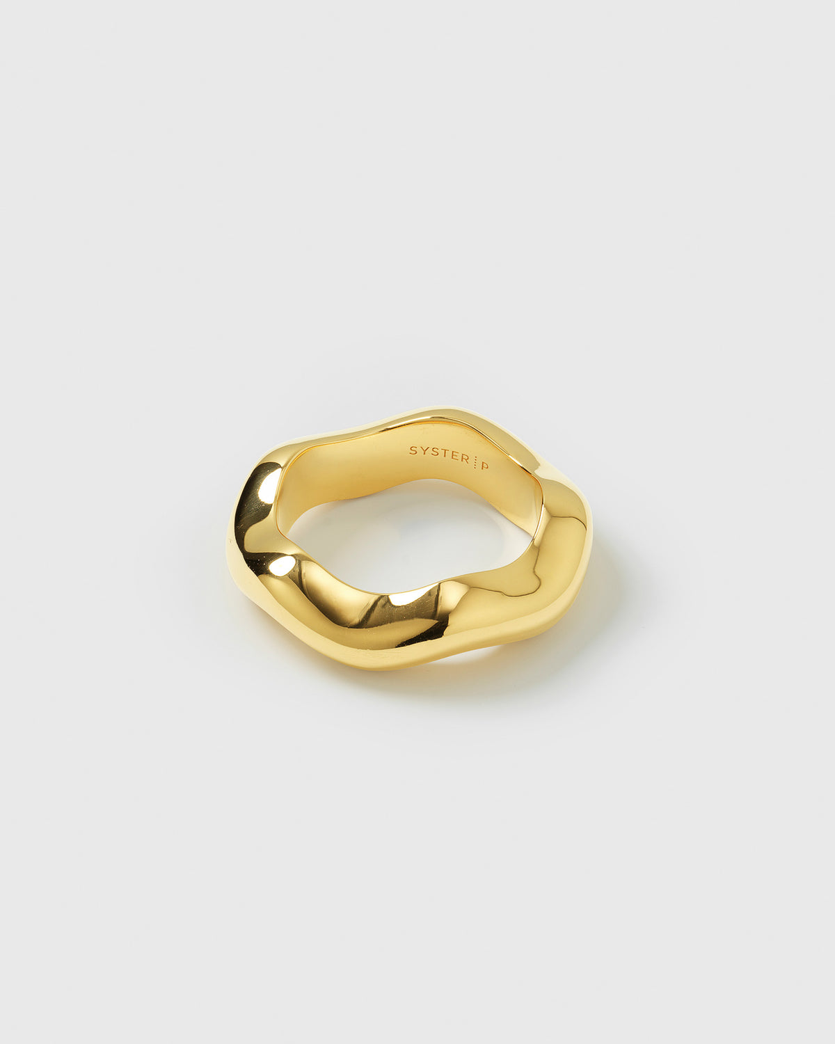 A product shot of the Bolded Wavy Ring in gold, showcasing its shiny surface and elegant, wavy design.