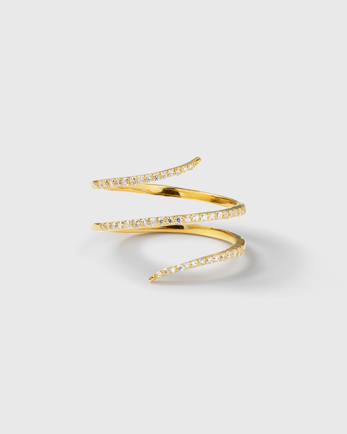 A product shot of the Sparkle Wrap Ring in gold, showcasing its wrap-around design adorned with sparkling cubic zirconia stones.
