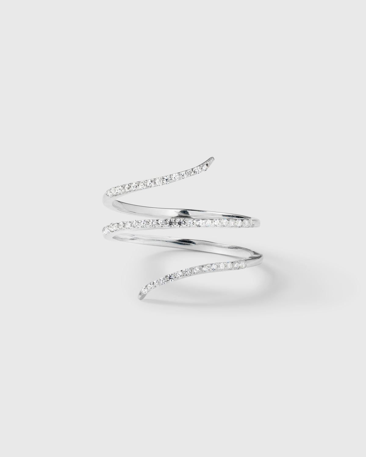 A product shot of the Sparkle Wrap Ring in silver, showcasing its elegant spiral design adorned with a row of sparkling cubic zirconia stones.
