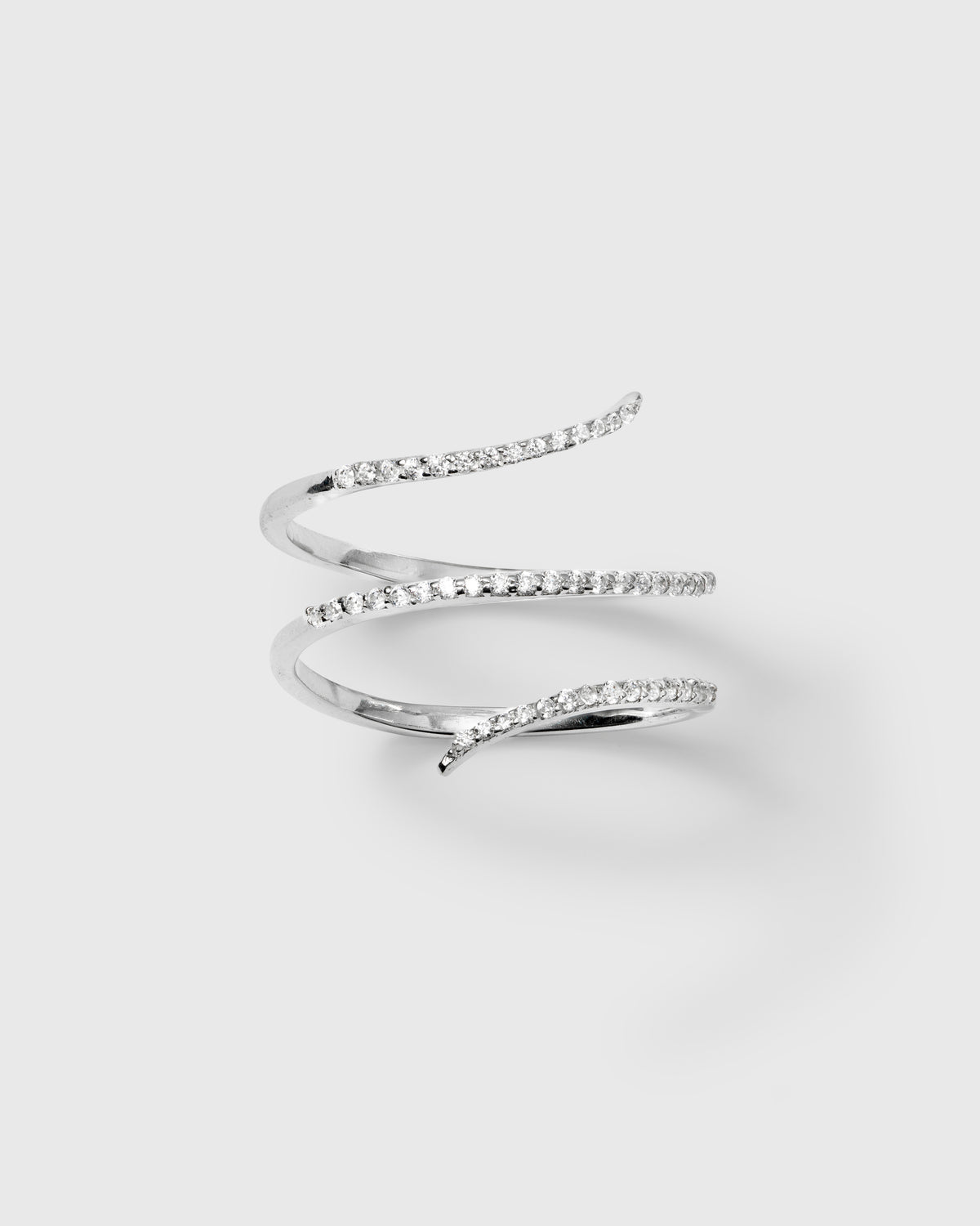 A product shot of the Sparkle Wrap Ring in silver, showcasing its spiral design adorned with shimmering cubic zirconia stones.