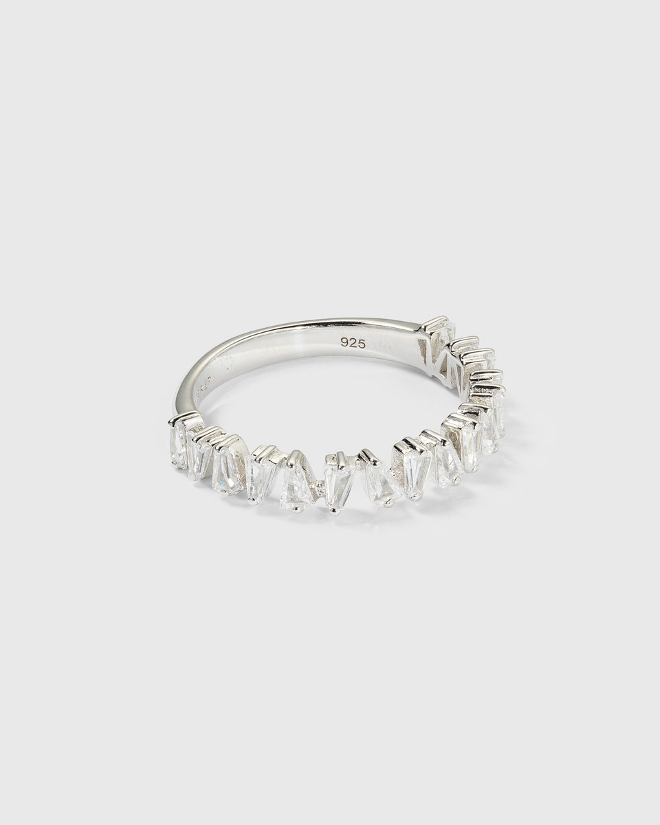 A product shot of the Iggy Ring Silver, featuring its design of small, tapered baguette-cut cubic zirconias set along the top of the band.