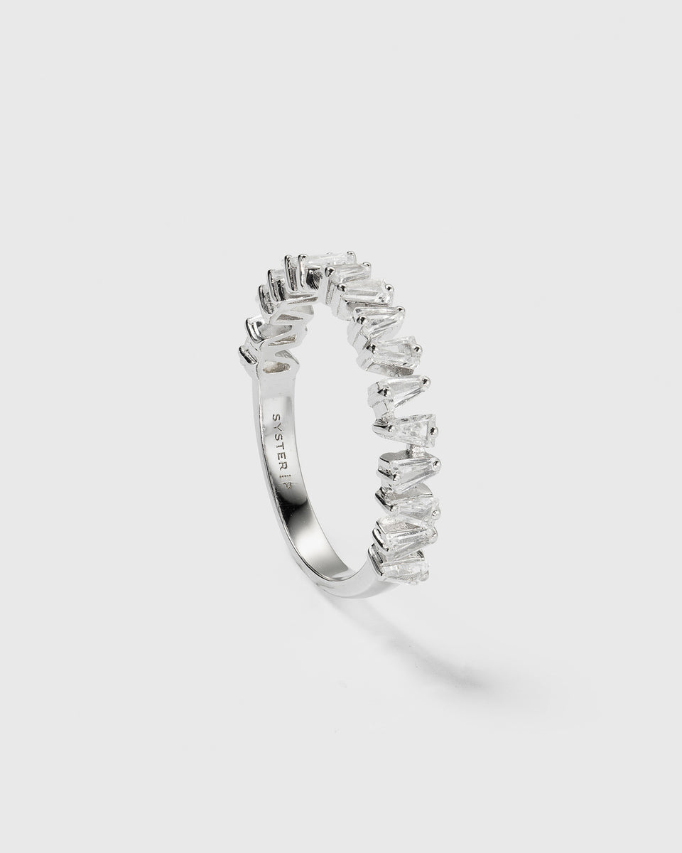 A product shot of the Iggy Ring in silver, showing its band adorned with sparkling, tapered baguette-cut cubic zirconias.