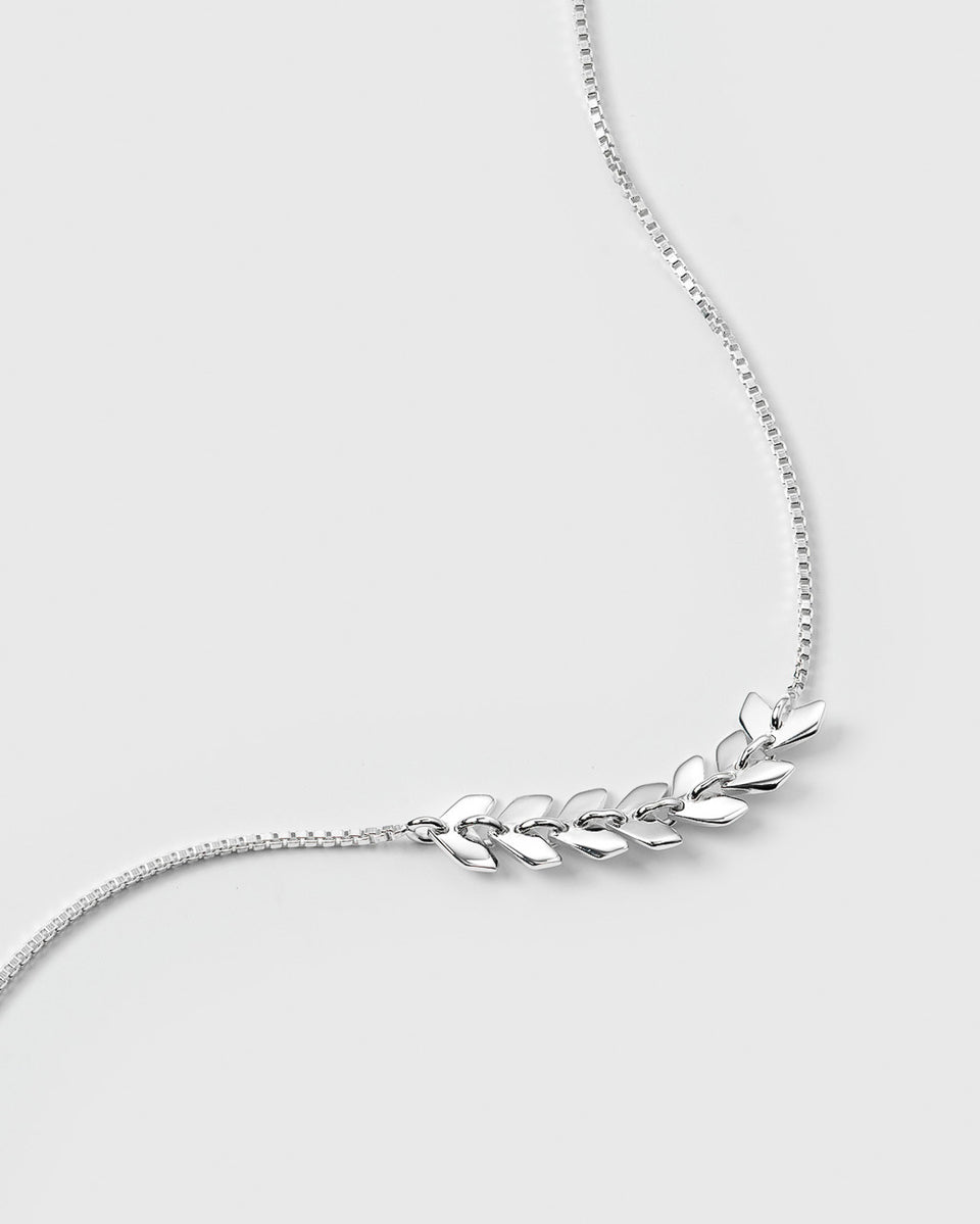 A close-up of the Layers Simone Bracelet in recycled sterling silver, showcasing the intricate pattern of small, leaf-like links on a fine box chain.