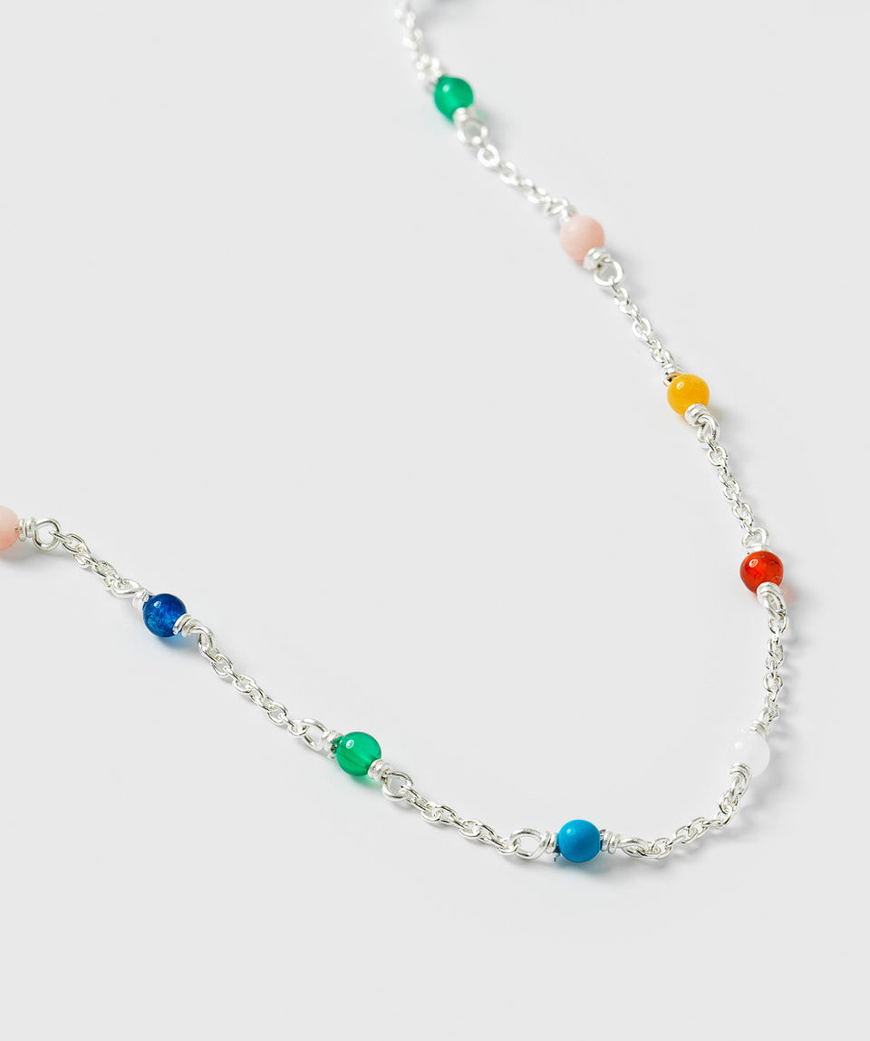 A close-up of the Santa Monica Bracelet in silver, showcasing its chain design adorned with various colorful gemstone beads: Yellow Jade, Pink Opal, Sodalite, Green Onyx, Blue Color Reconstituted Turquoise, Vit Agate and Carnelian.