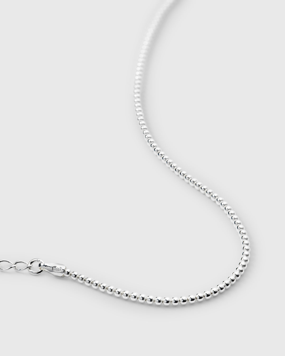 Sheer Doria Bracelet from Syster P in silver, featuring a close-up of its delicate chain composed of small, polished silver beads.