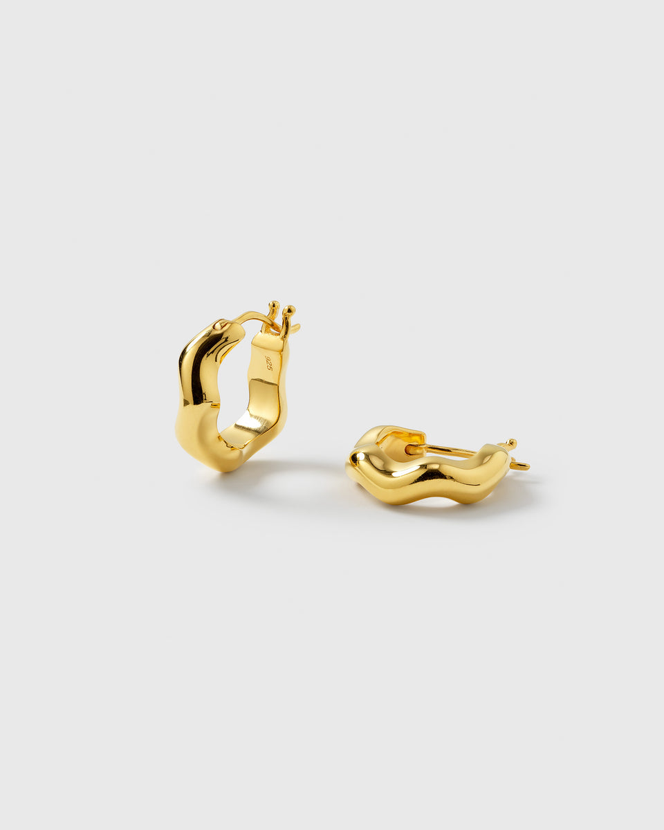 A product shot of the Bolded Wavy Earrings in gold, showcasing their unique wavy design and shiny finish.