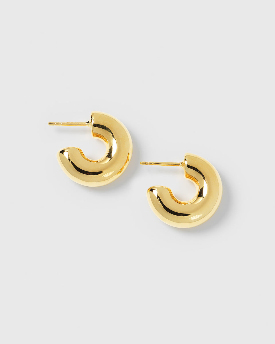 A product shot of the Bolded Little Sis Hoops in gold, showcasing their chunky and curved design.