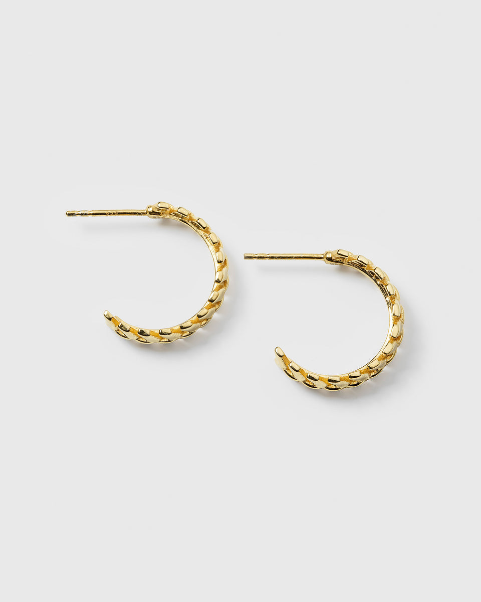 A product shot of the Layers Olivia Hoops in gold, laid out to display their design of small, interconnected leaf-like parts.