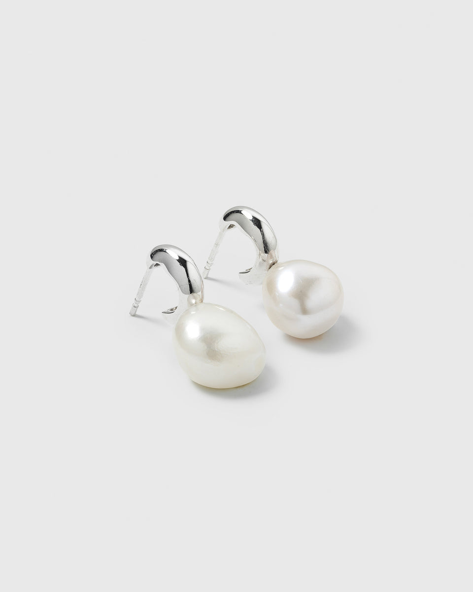 A close-up image of the Paxton Earrings in silver, showcasing the recycled sterling silver earrings and their unique baroque freshwater pearl pendants.