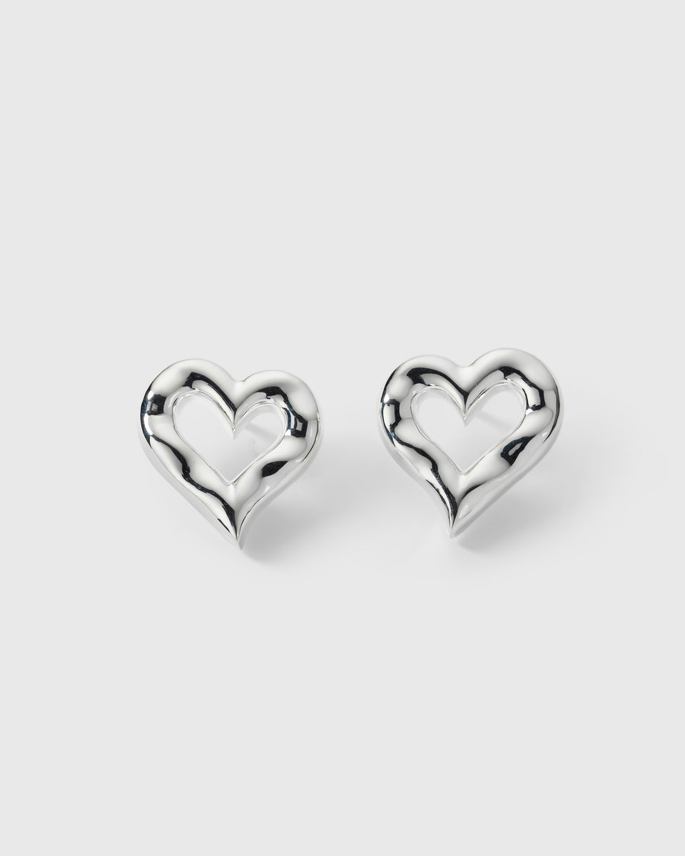 A product shot of the Puff Heart Earrings in silver, highlighting their chunky and organic heart-shaped design.