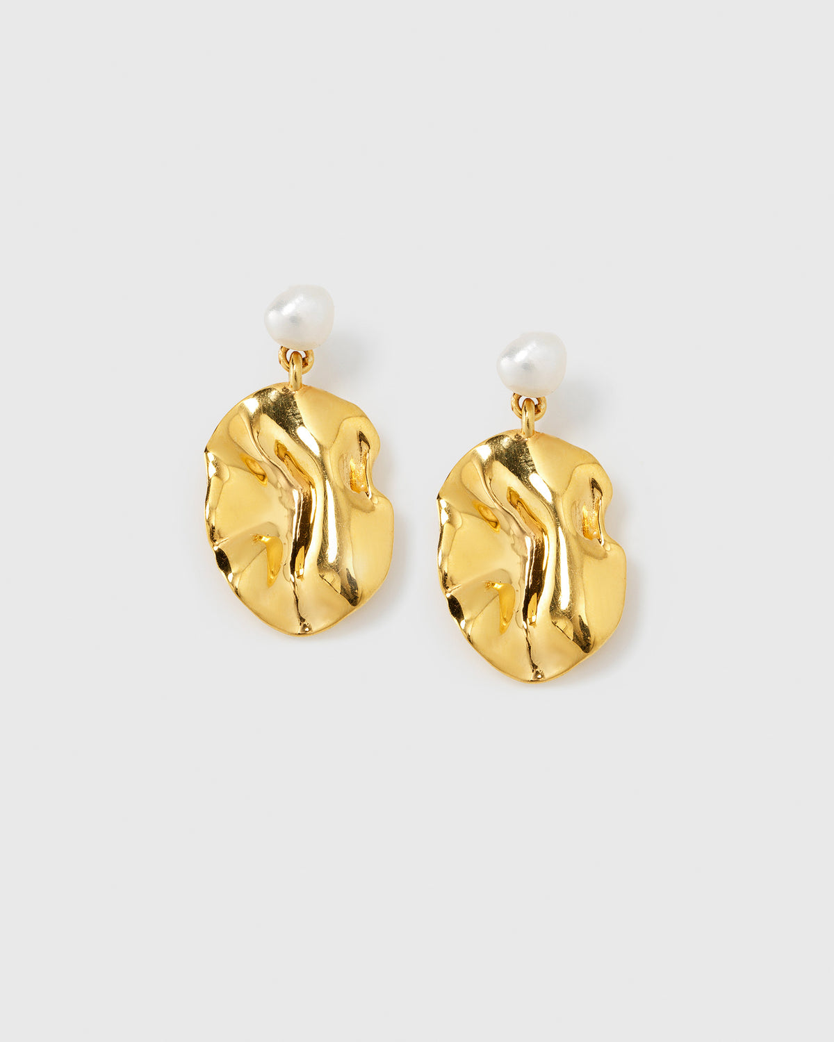 A product shot of the Moulded Short Earrings Gold, featuring their unique design with an irregularly shaped gold surface and a single freshwater pearl.