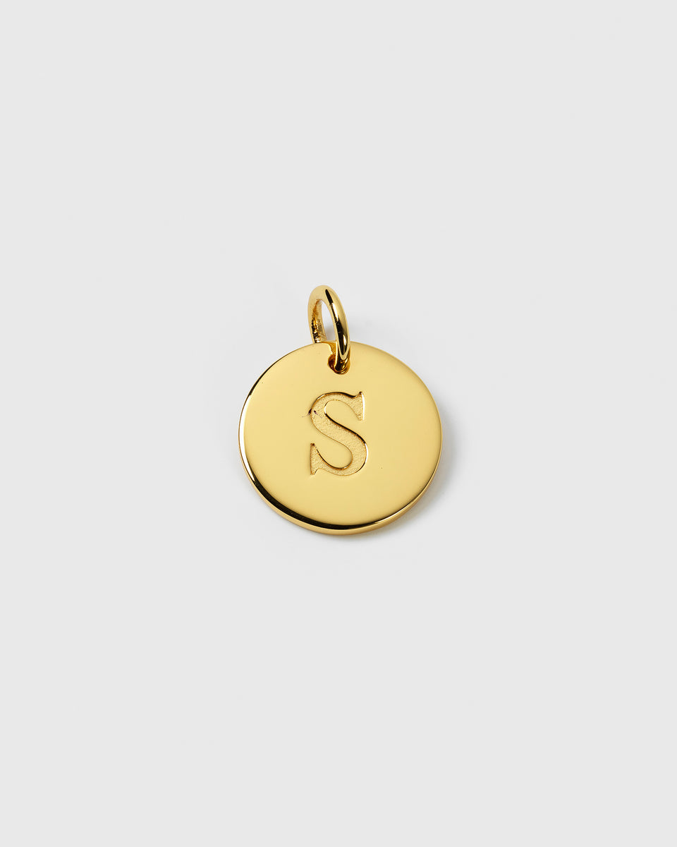 A product shot of the Beloved Big Letter Gold pendant, featuring a round gold charm with the letter 'S' engraved in the center.