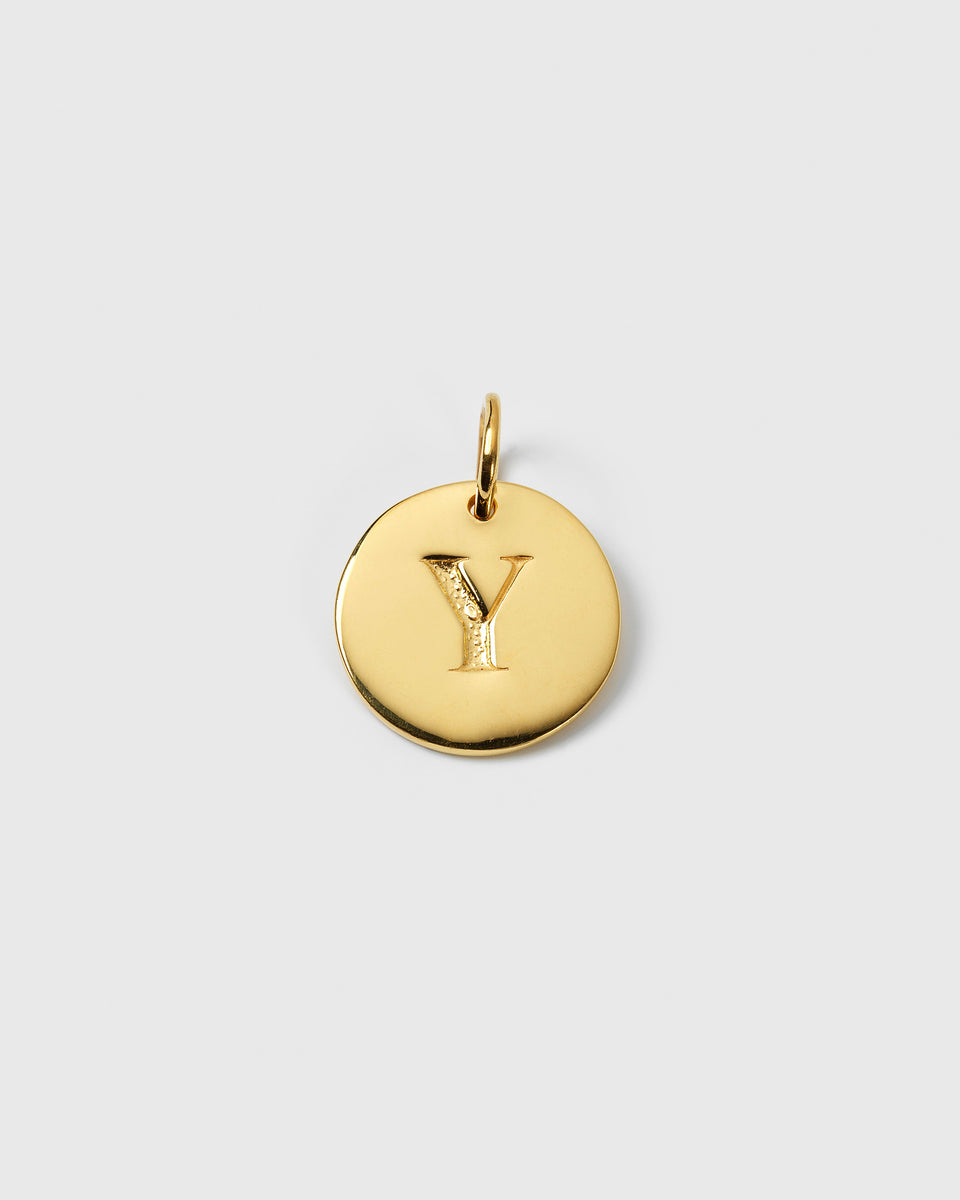 A product shot of the Beloved Big Letter 'Y' charm in gold, a round pendant with the initial engraved in the center.