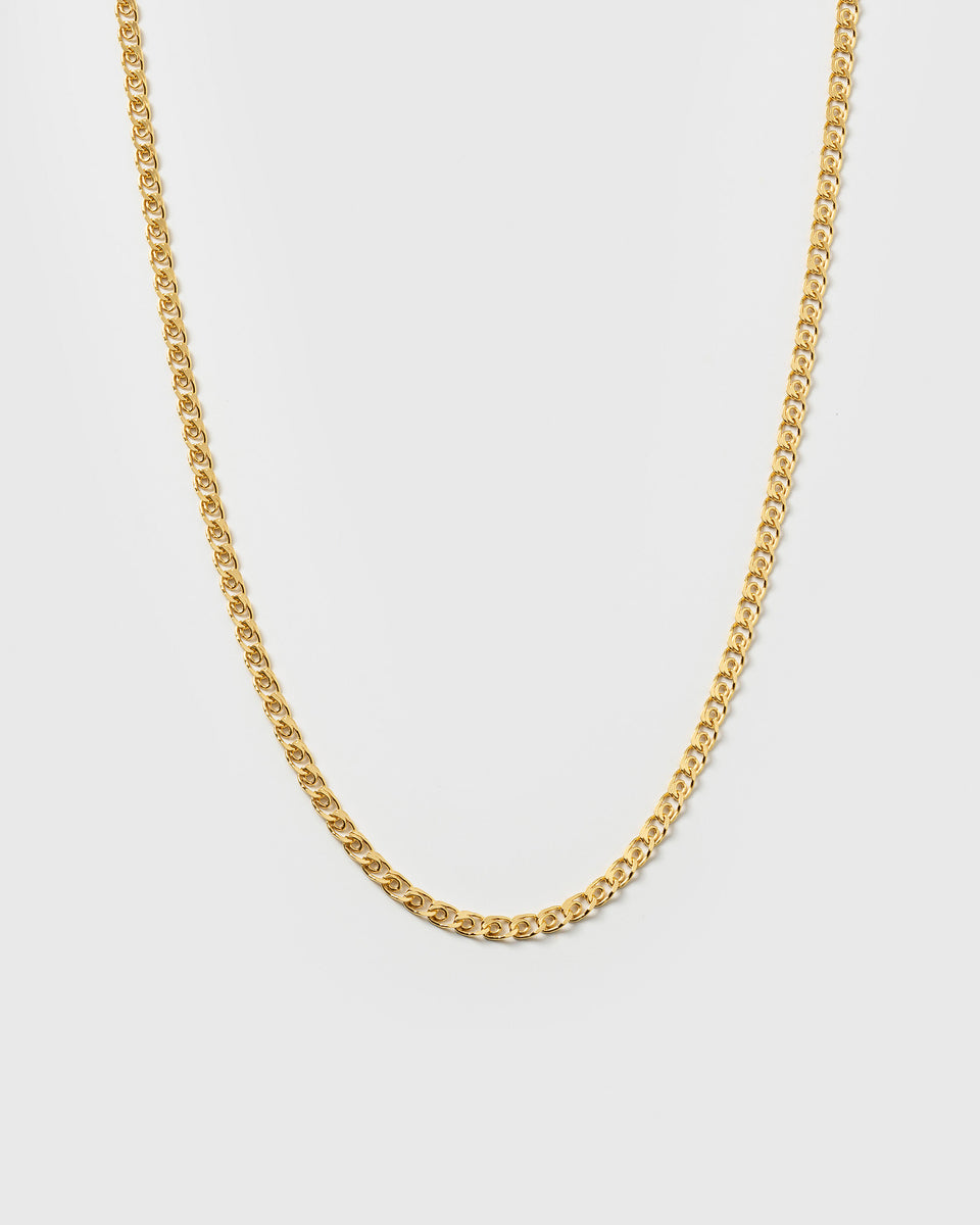 A product shot of the Sheer Love Necklace in gold, featuring its distinctive patterned chain.