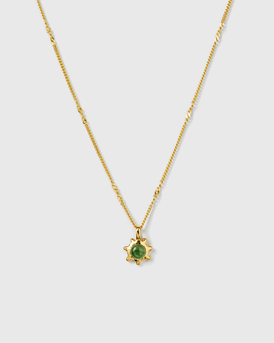 A product shot of the Florentina Necklace in gold, featuring a delicate twisted chain and a flower-shaped pendant with a green jade stone.