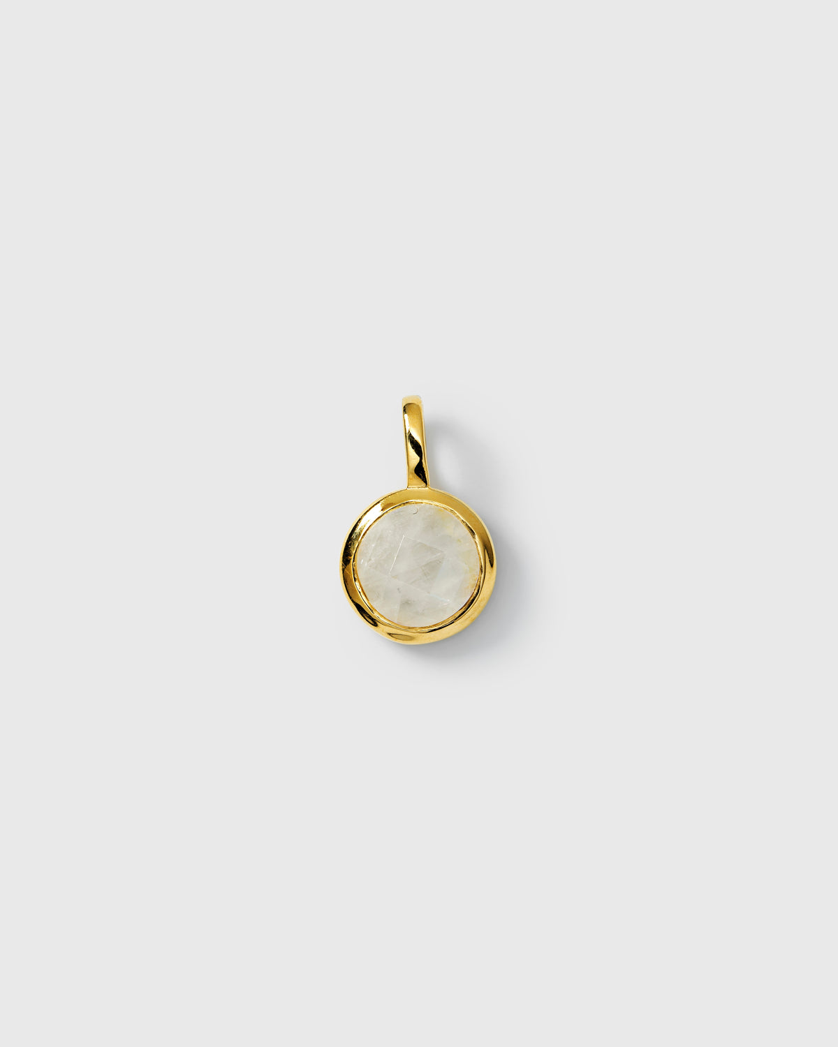 Gold pendant featuring a round moonstone, June birthstone.