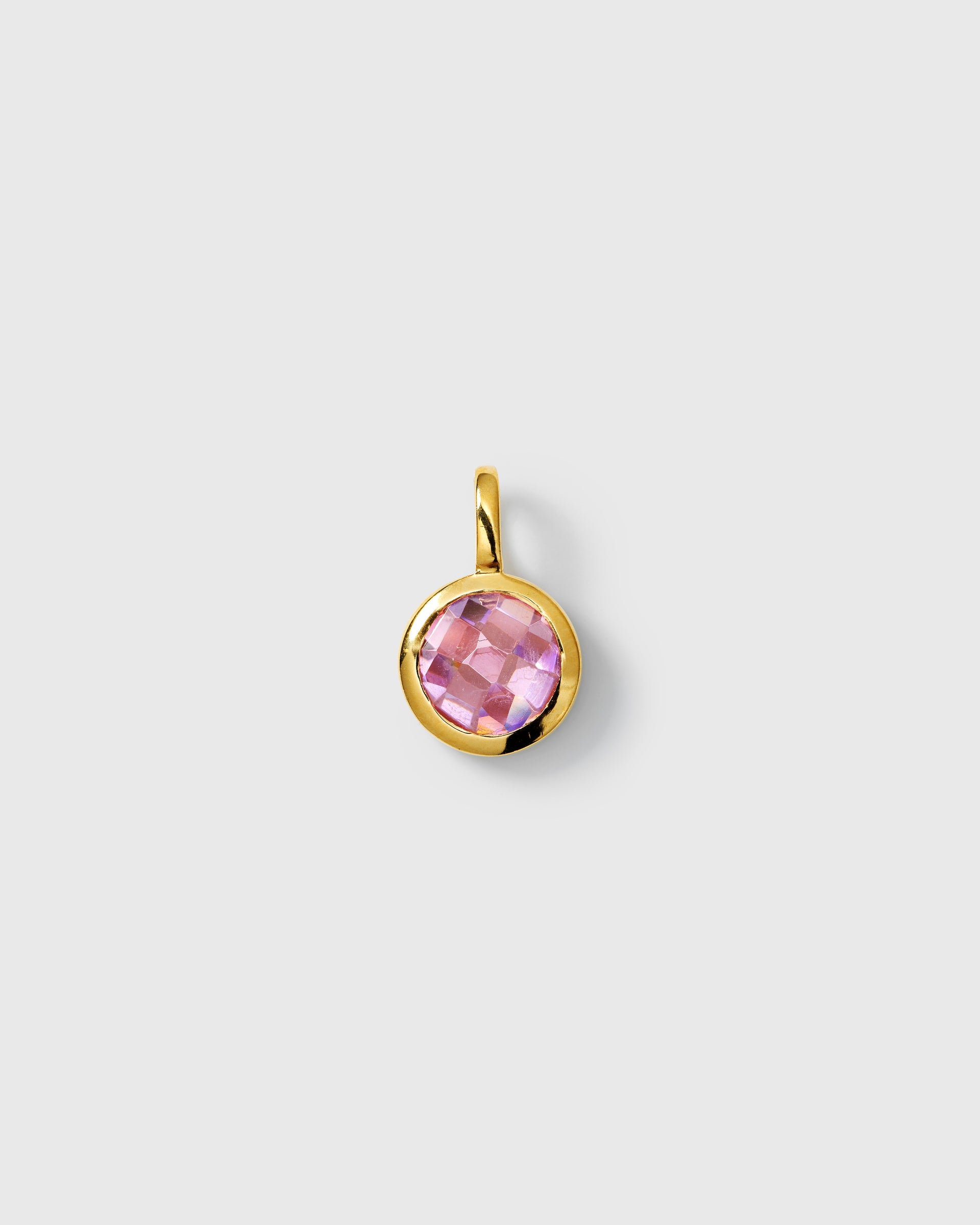 Gold pendant featuring a round faceted pink tourmaline cubic zirconia, October birthstone.