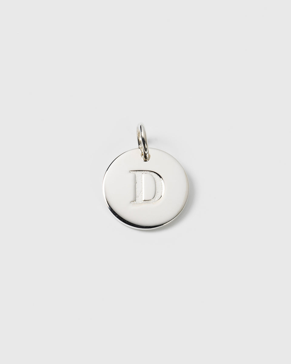 A product shot of the Beloved Big Letter charm in silver, featuring a round pendant with the engraved letter 'D'.
