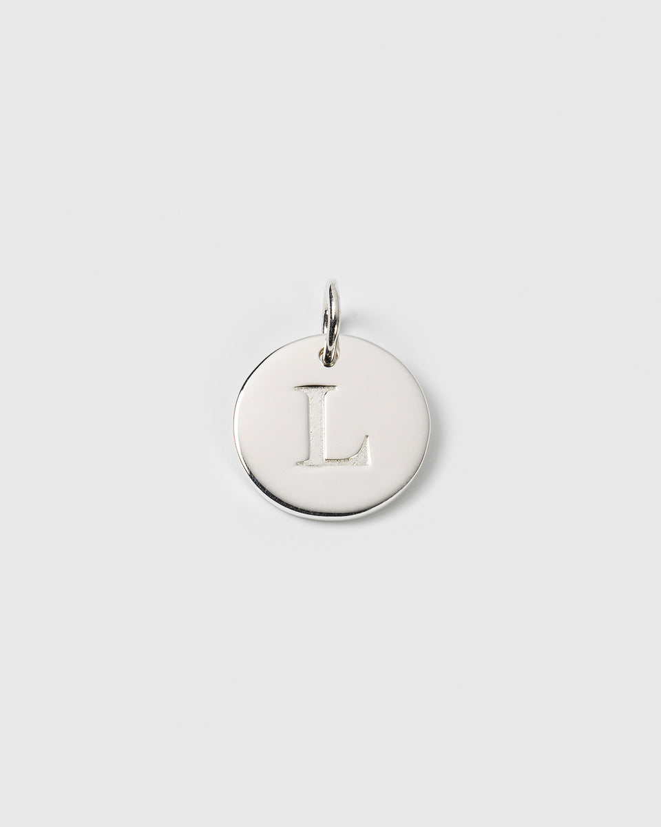 A product shot of the Beloved Big Letter charm in silver, featuring a round pendant with the letter 'L' engraved on it.