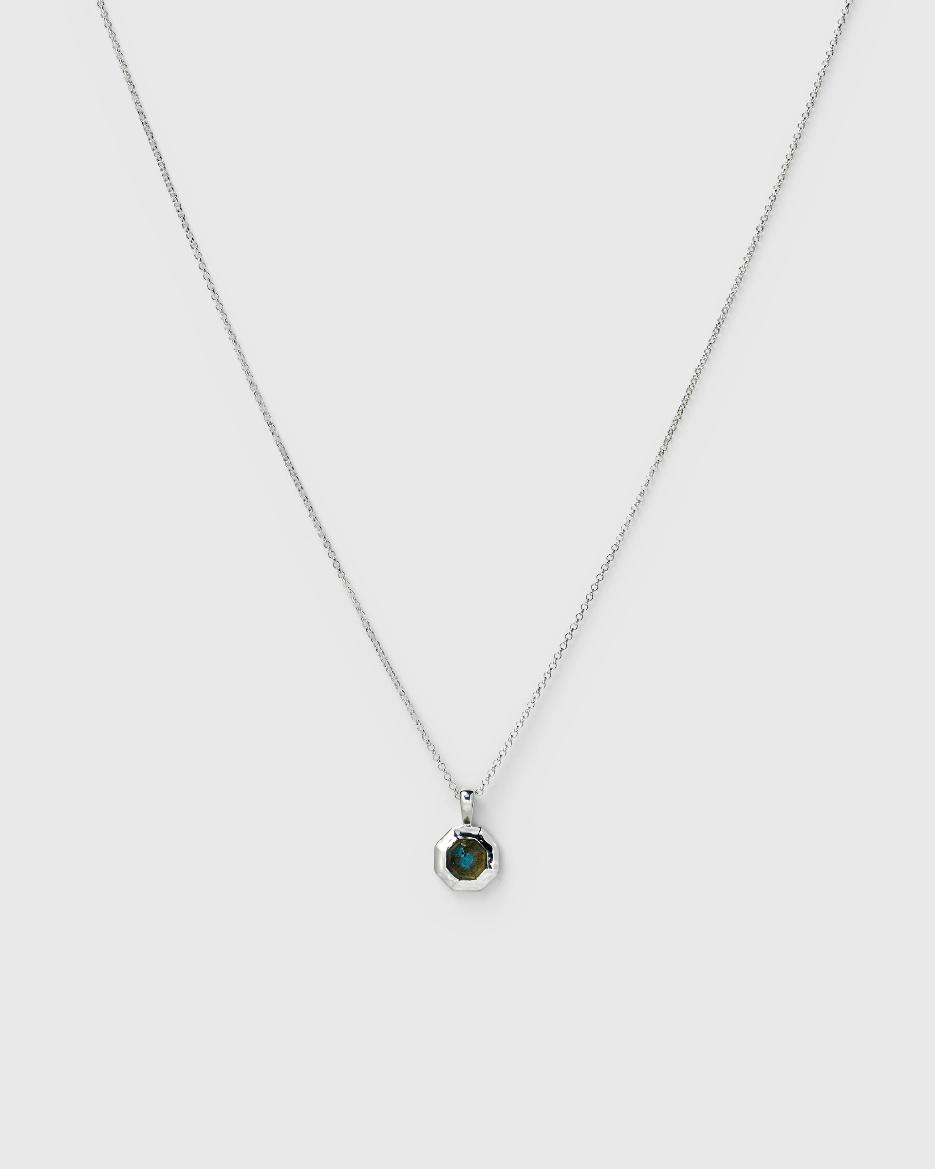 A necklace in silver, featuring an octagonal pendant with a labradorite stone.