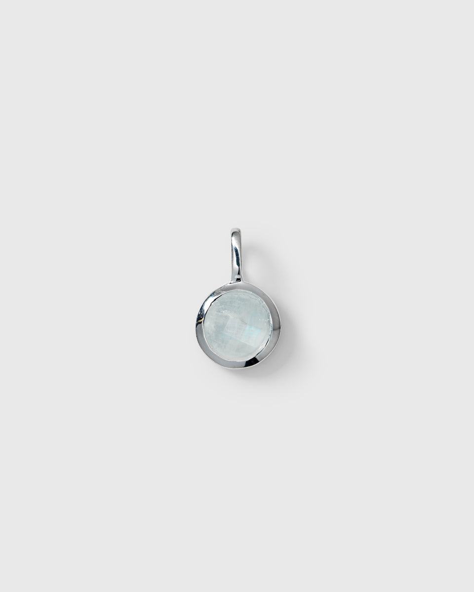 Silver pendant featuring a round light blue aquamarine, March birthstone.