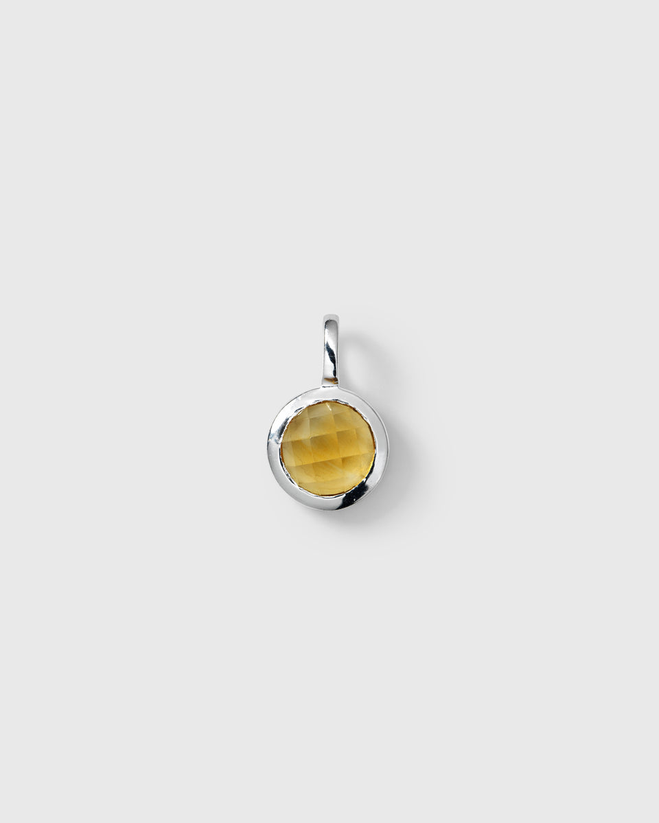 Silver pendant featuring a round faceted yellow citrine, November birthstone.