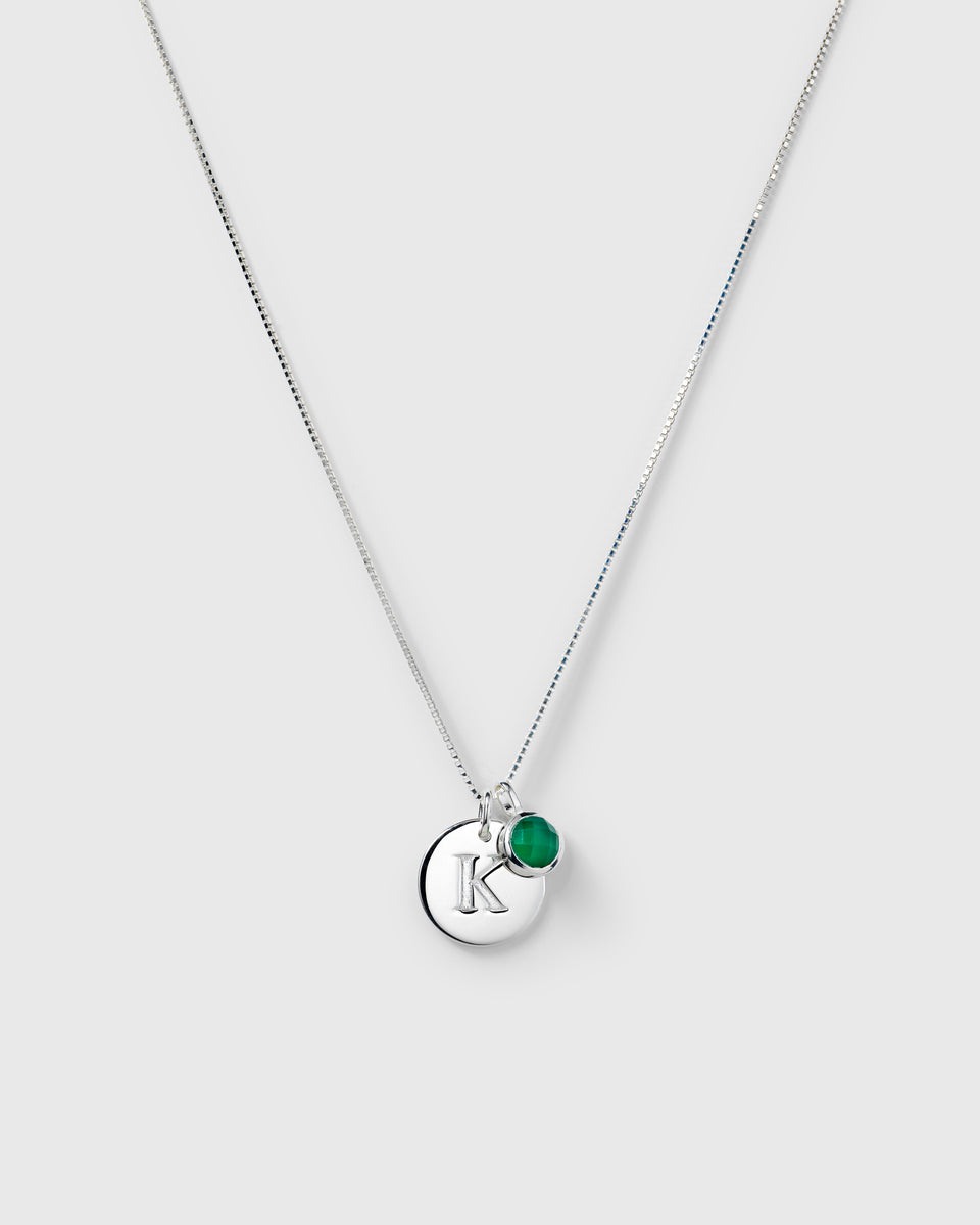 Silver chain with May birthstone green onyx pendant and letter charm.