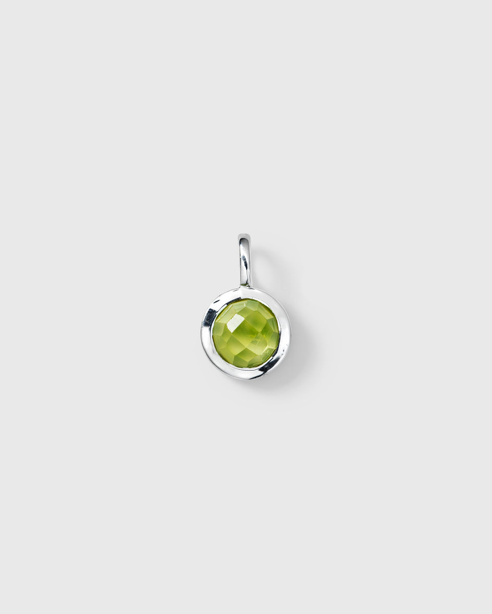 Silver pendant featuring a round faceted green peridot, August birthstone.
