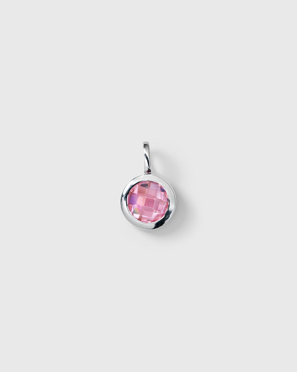 Silver pendant featuring a round faceted pink tourmaline, October birthstone.