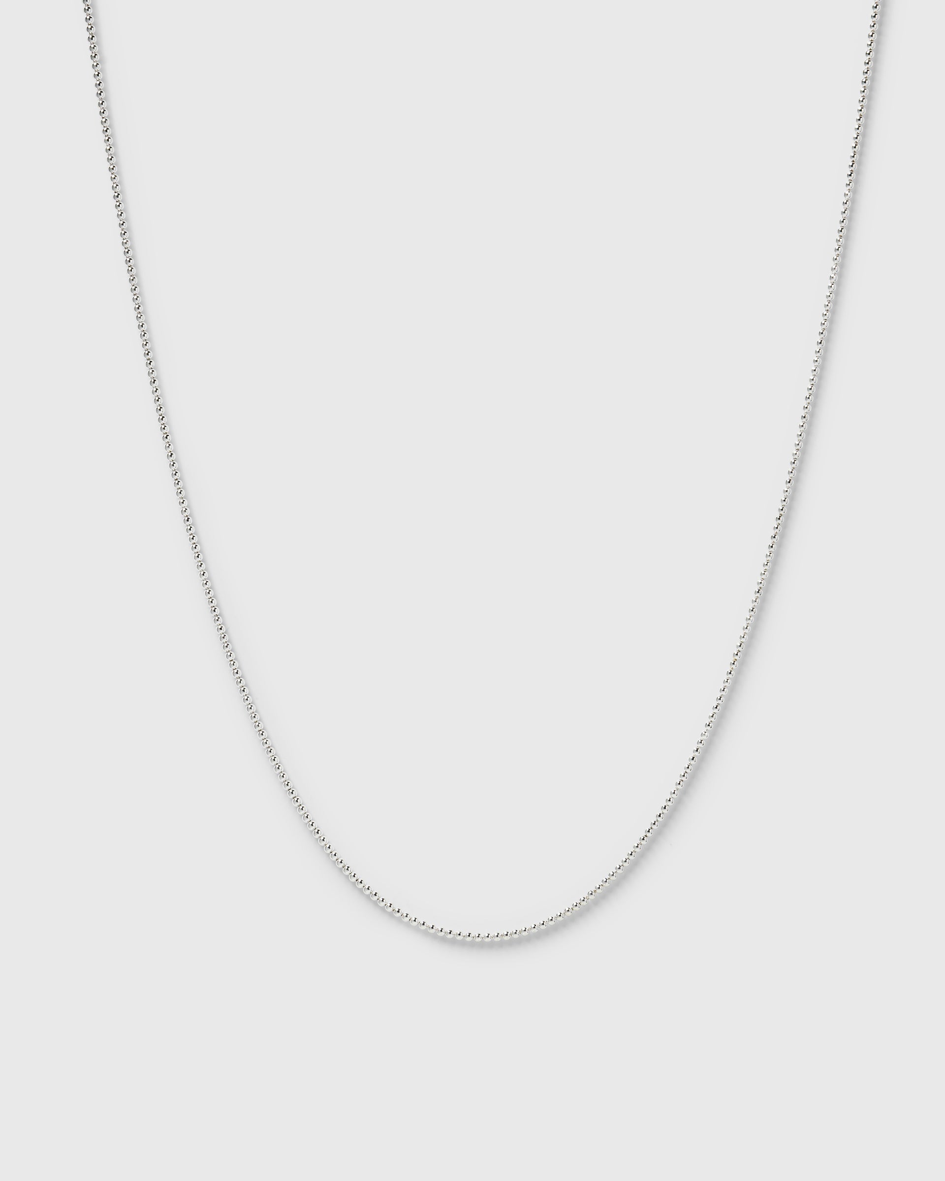 A product shot of the Syster P Sheer Doria Necklace in silver, featuring a delicate ball chain design.