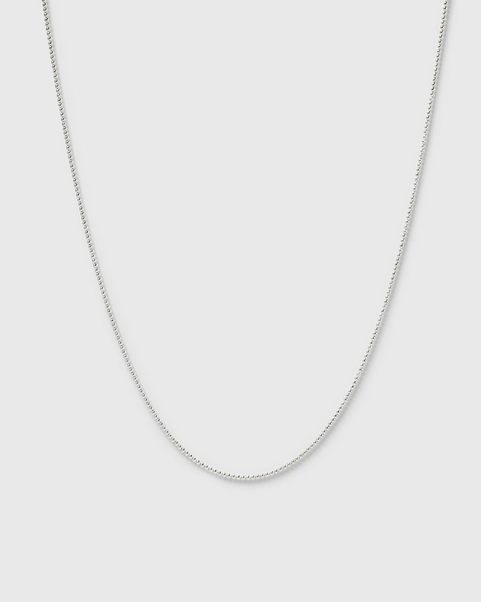 A product shot of the Syster P Sheer Doria Necklace in silver, featuring a delicate ball chain design.