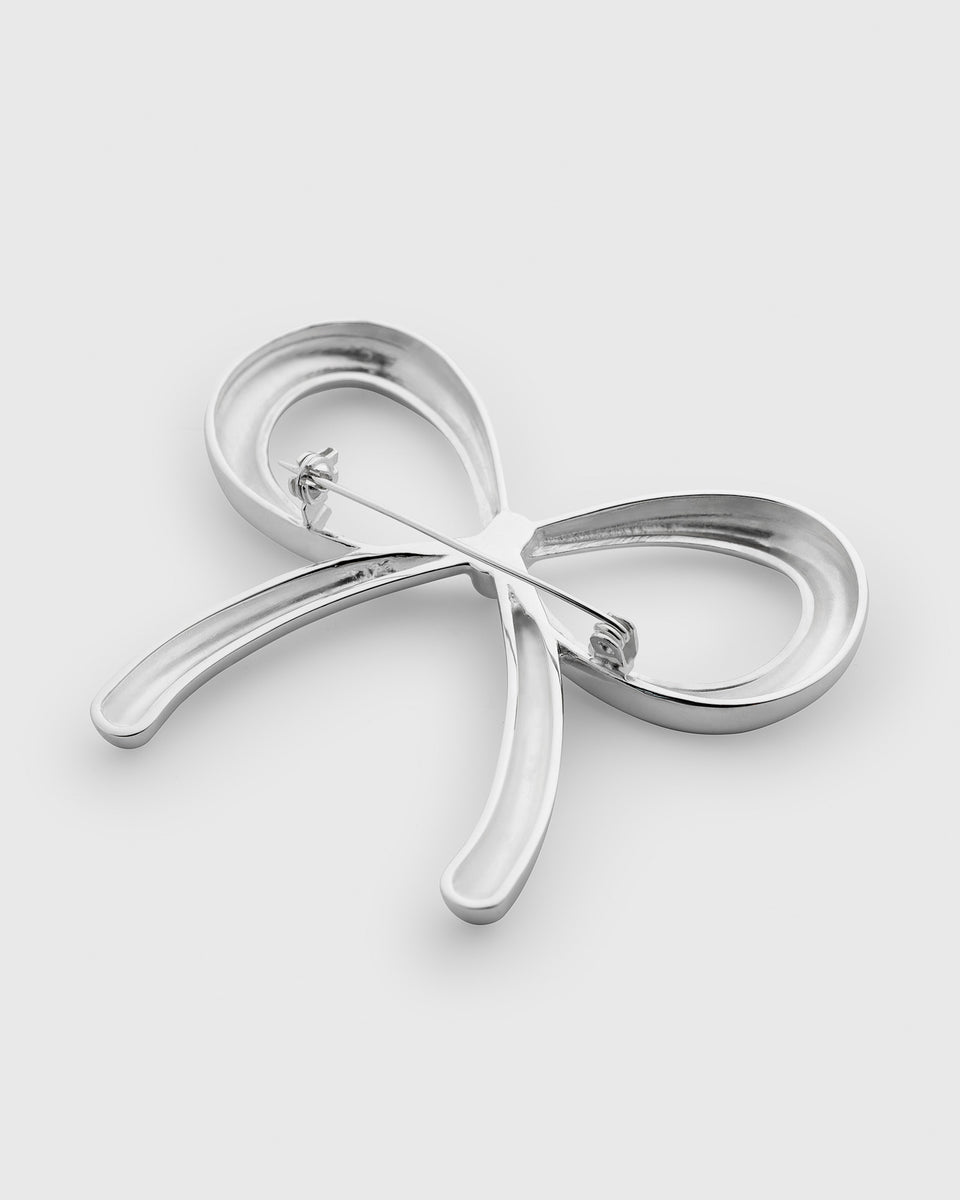 A product shot of the Ana Brooch in silver, photographed from the back to show the pin fastening.