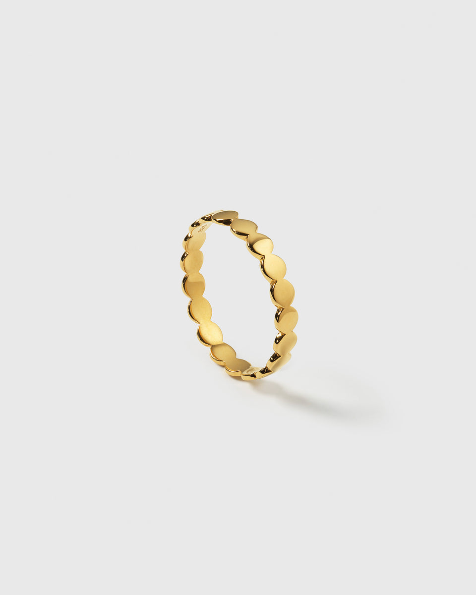 A product shot of the Beaches Flat Dots Ring Gold, featuring its delicate band made up of interconnected flat dots.