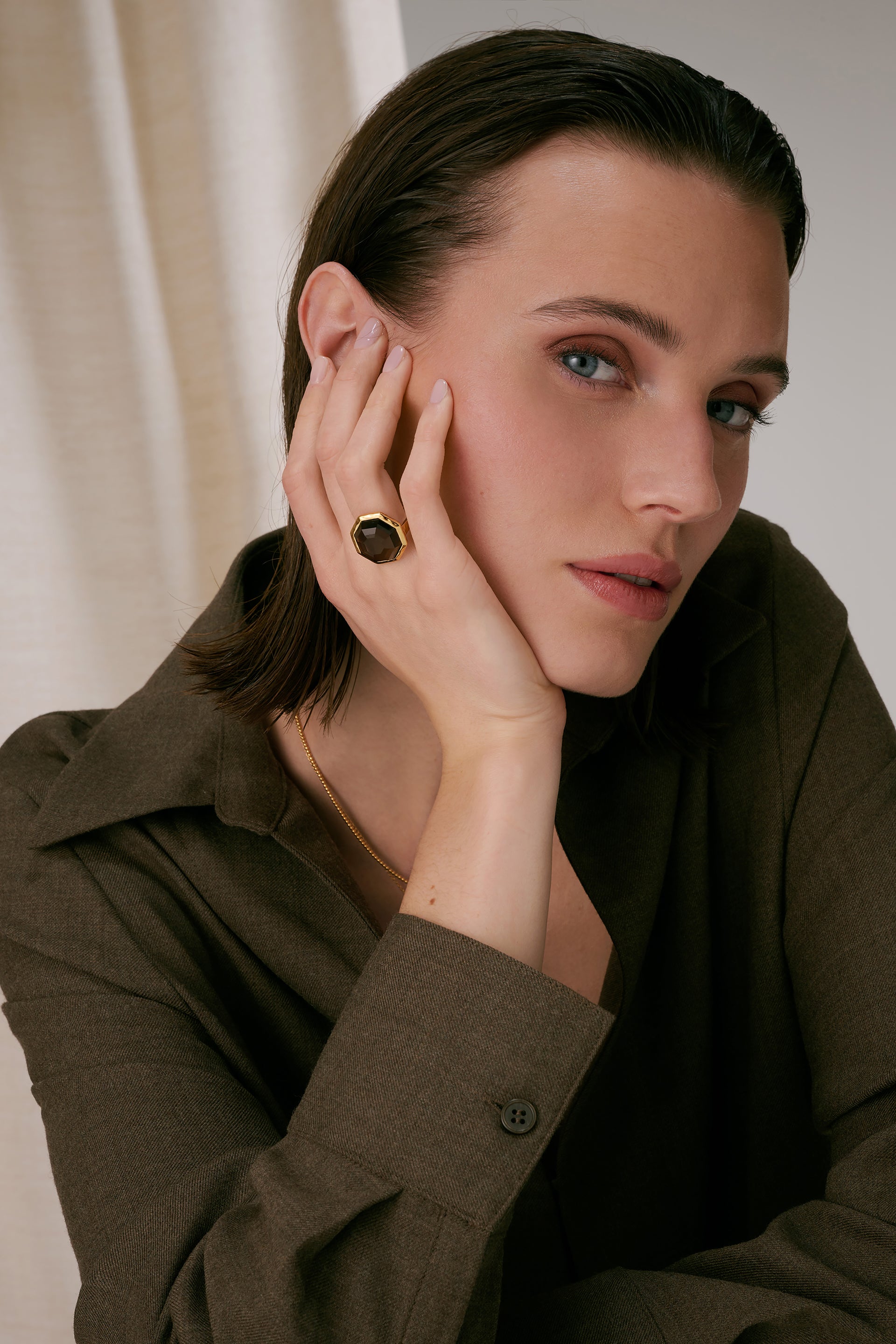 A statement ring with an octagon-shaped faceted smokey quartz.