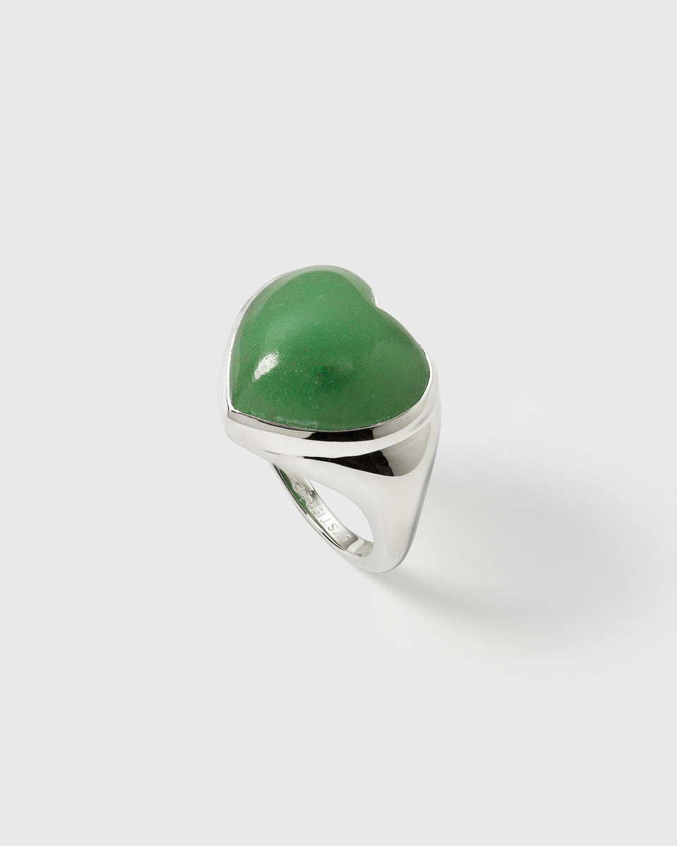 A close-up of the La La Love Big Heart Ring in recycled sterling silver, featuring a large statement green jade heart.