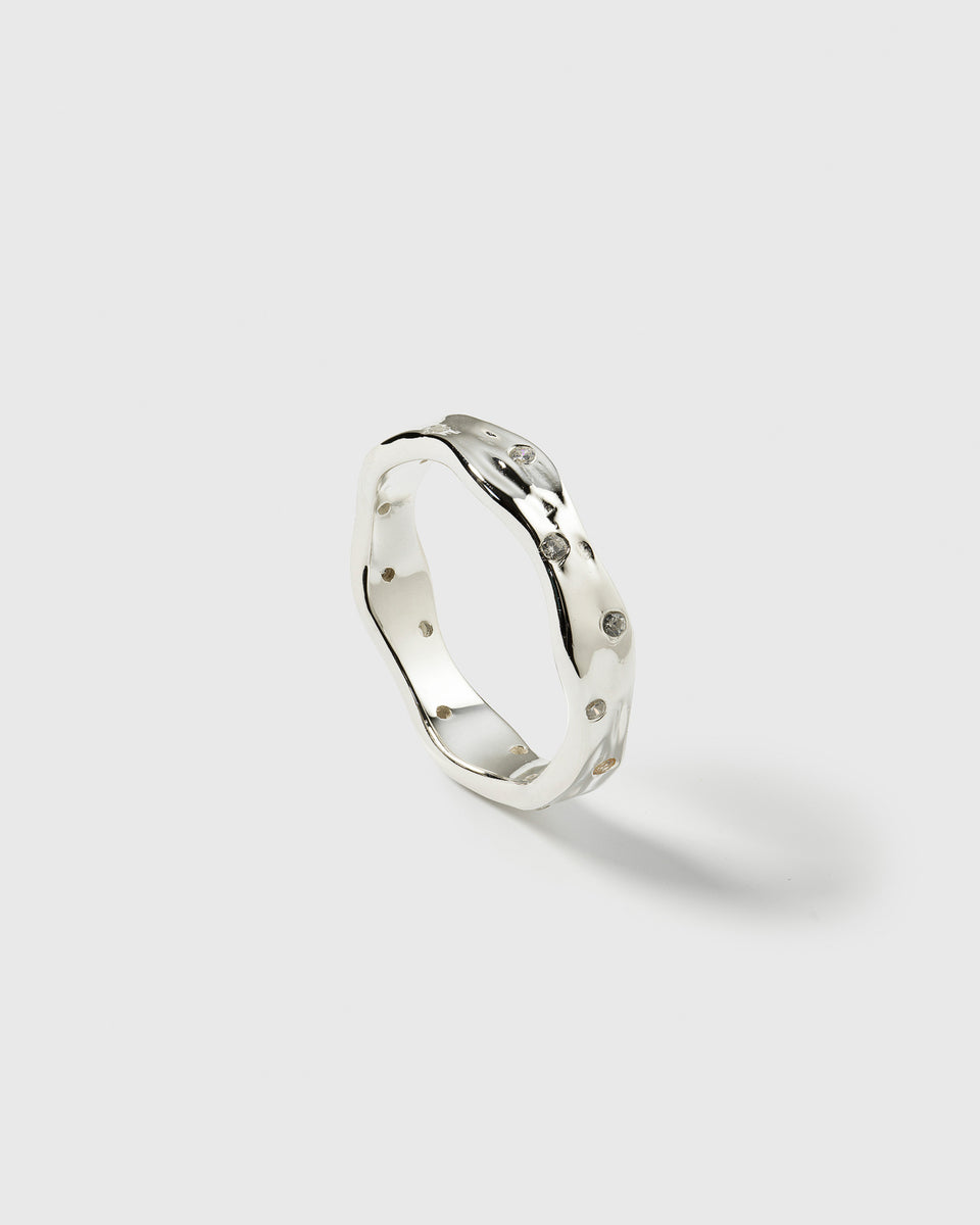 A product shot of the Melting Narrow Ring in silver, showcasing its unique design with a melted look and irregularly set sparkling zirconias.