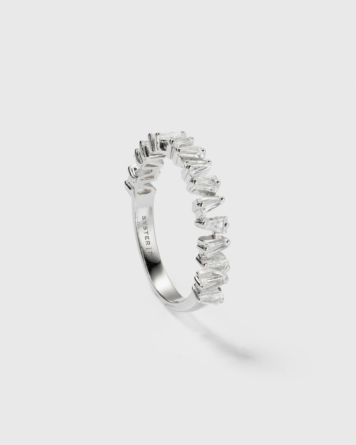 A product shot of the Iggy Ring in silver, showing its band adorned with sparkling, tapered baguette-cut cubic zirconias.