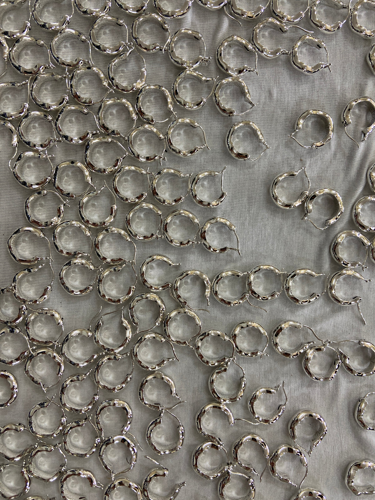 Bolded Wavy Earrings all done in one of our factories in India. All our jewelry is made from 100% recycled sterling silver.